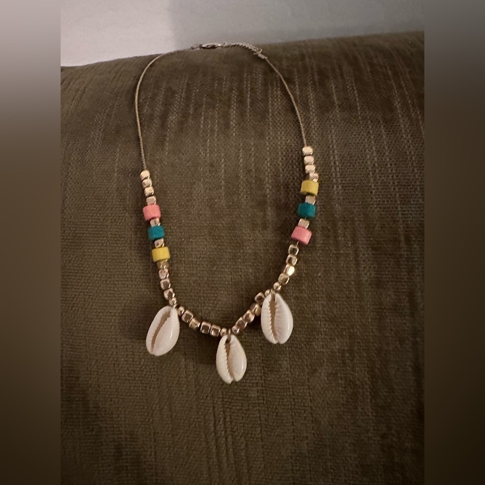 Ladies gold toned necklace with colorful beads and shells